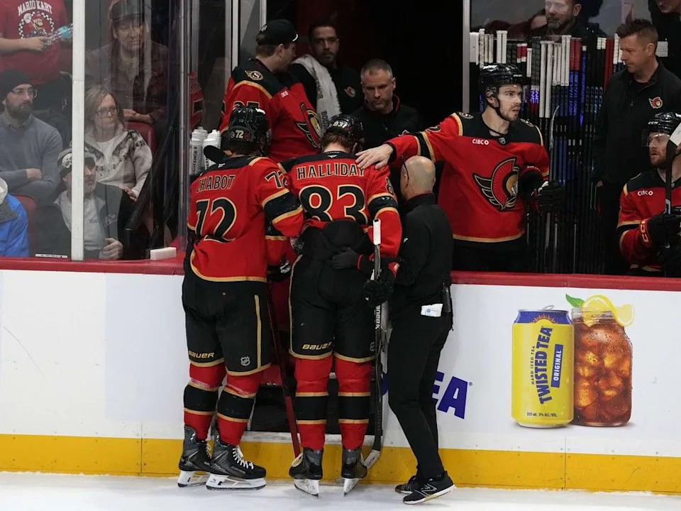  The Ottawa Senators’ Stephen Halliday is helped off the ice after getting injured during the third period against the Vegas Golden Knights in Ottawa on Sunday, Jan. 25, 2026.