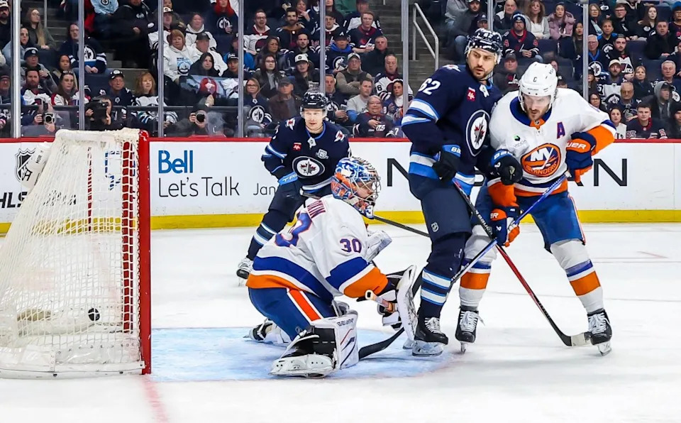 Winnipeg players Vladislav Namestnikov (7) and Nino Niederreiter (62) look on as the puck gets behind goaltender Ilya Sorokin for a second-period goal during the Islanders’ 5-4 road loss to the Jets on Jan. 13, 2025. NHLI via Getty Images