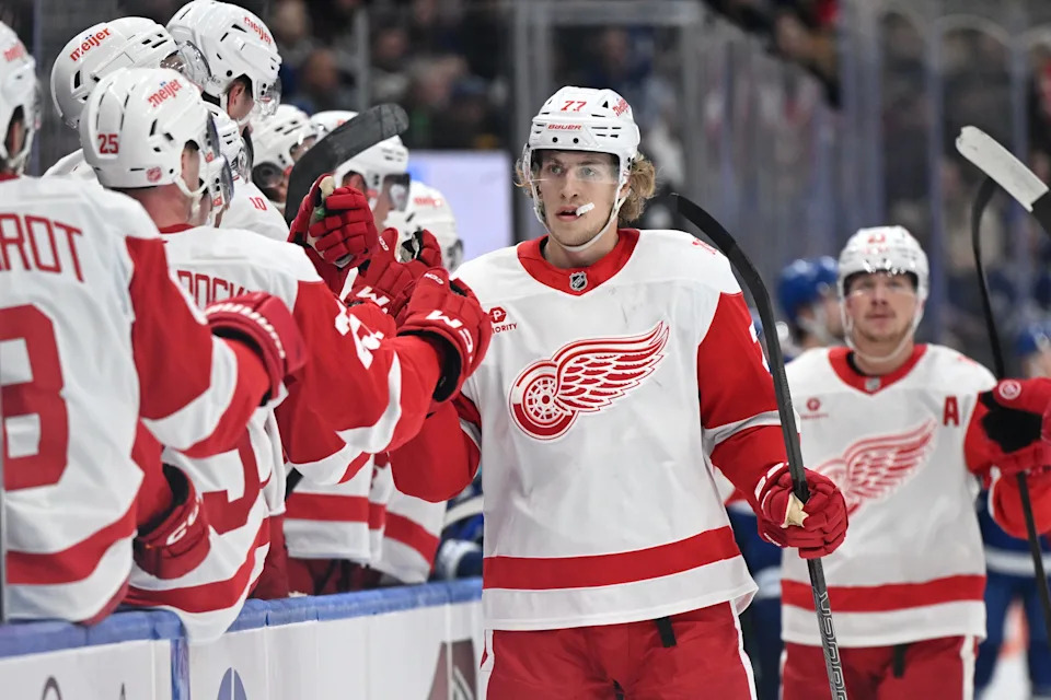 Detroit Red Wings defenseman Simon Edvinsson (77) celebrates with teammates at the bench after scoring a goal against the Toronto Maple Leafs in the first period at Scotiabank Arena in Toronto on Wednesday, Jan. 21, 2026.
