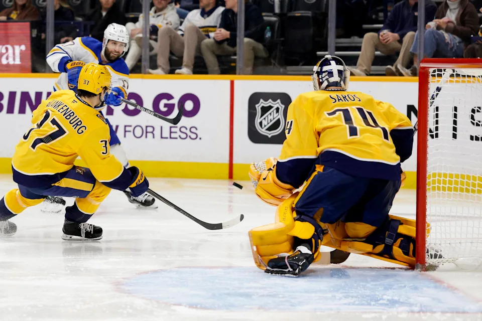 Jan 20, 2026; Nashville, Tennessee, USA; Nashville Predators goaltender Juuse Saros (74) blocks the shot of Buffalo Sabres left wing Jason Zucker (17) during the second period at Bridgestone Arena. Mandatory Credit: Steve Roberts-Imagn Images
