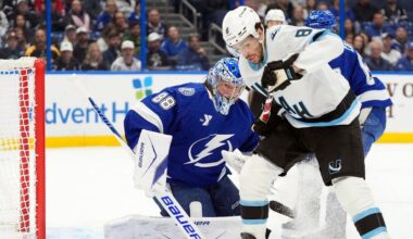 Tampa Bay Lightning goaltender Andrei Vasilevskiy (88) stops a shot by Utah Mammoth center Nick Schmaltz (8) during the first period of an NHL hockey game Monday, Jan. 26, 2026, in Tampa, Fla. (AP Photo/Chris O'Meara)