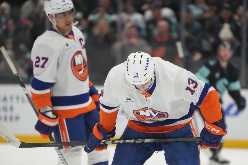 New York Islanders center Mathew Barzal looks down after a goal by Seattle Kraken defenseman Vince Dunn during the second period of an NHL hockey game Wednesday, Jan. 21, 2026, in Seattle.
