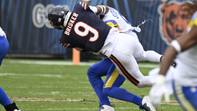 Sep 29, 2024; Chicago, Illinois, USA; Chicago Bears safety Jaquan Brisker (9) sacks Los Angeles Rams quarterback Matthew Stafford (9) during the second half at Soldier Field.