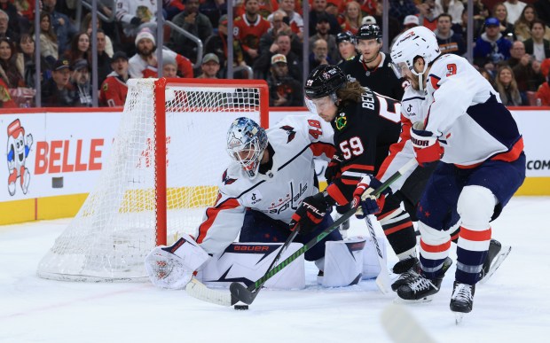 Blackhawks left wing Tyler Bertuzzi (59) is blocked by Capitals defenseman Matt Roy (3) near the goal in the first period at the United Center on Jan. 9, 2026, in Chicago. (John J. Kim/Chicago Tribune)