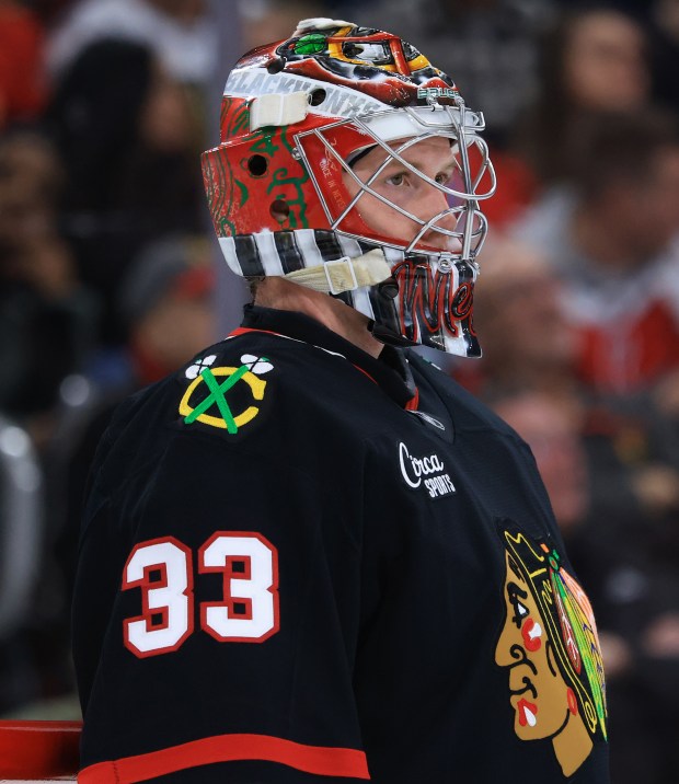 Blackhawks goaltender Drew Commesso waits for play to resume in the second period against the Capitals at the United Center on Jan. 9, 2026, in Chicago. (John J. Kim/Chicago Tribune)