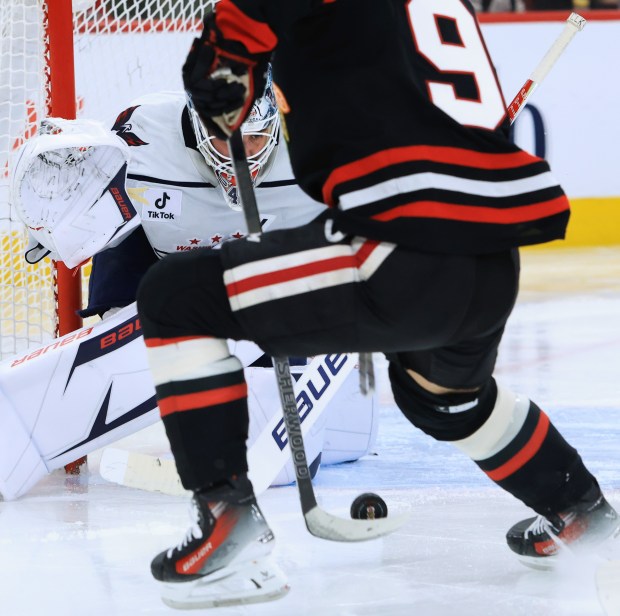 Capitals goaltender Logan Thompson eyes the puck handled by Blackhawks center Connor Bedard in the third period at the United Center on Jan. 9, 2026, in Chicago. (John J. Kim/Chicago Tribune)