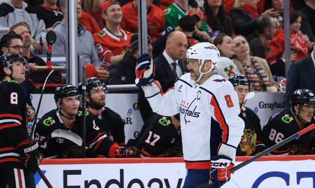Capitals left wing Alex Ovechkin (8) skates past the Blackhawks bench after scoring a goal in the third period at the United Center on Jan. 9, 2026, in Chicago. (John J. Kim/Chicago Tribune)