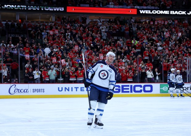Winnipeg Jets center Jonathan Toews (19) is honored during a timeout in the first period of a game against the Chicago Blackhawks at the United Center in Chicago on Jan. 19, 2026. (Chris Sweda/Chicago Tribune)