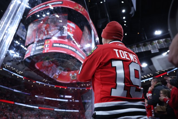 Fans applaud as Winnipeg Jets center Jonathan Toews (19) is honored during a timeout in the first period of a game against the Chicago Blackhawks at the United Center in Chicago on Jan. 19, 2026. (Chris Sweda/Chicago Tribune)