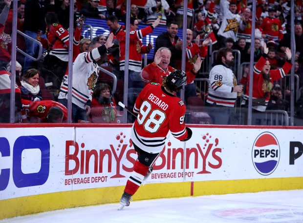 Chicago Blackhawks center Connor Bedard (98) celebrates after scoring an empty-net goal in the third period of a game against the Winnipeg Jets at the United Center in Chicago on Jan. 19, 2026. (Chris Sweda/Chicago Tribune)