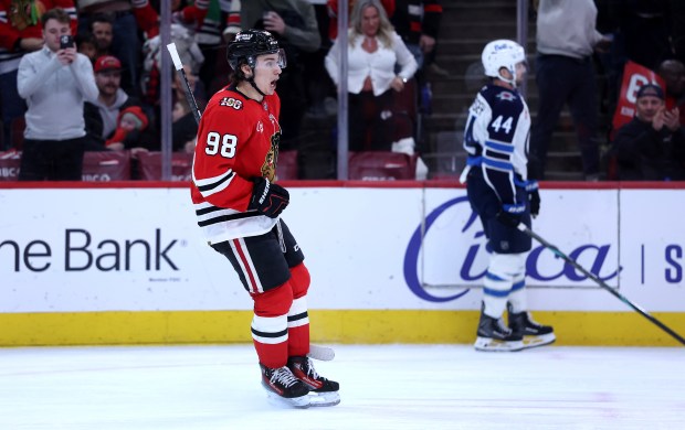 Chicago Blackhawks center Connor Bedard (98) celebrates after scoring an empty-net goal in the third period of a game against the Winnipeg Jets at the United Center in Chicago on Jan. 19, 2026. (Chris Sweda/Chicago Tribune)