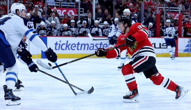 Chicago Blackhawks center Connor Bedard (98) takes a shot in the third period of a game against the Winnipeg Jets at the United Center in Chicago on Jan. 19, 2026. (Chris Sweda/Chicago Tribune)