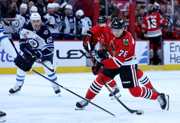 Chicago Blackhawks player Nick Lardis takes a shot in the first period of a game against the Winnipeg Jets at the United Center in Chicago on Jan. 19, 2026. (Chris Sweda/Chicago Tribune)