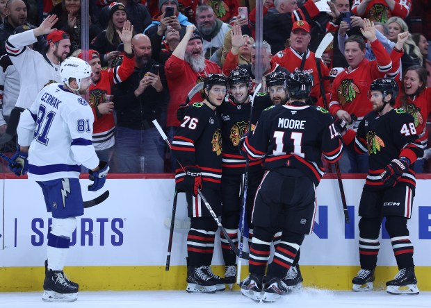Chicago Blackhawks center Ryan Greene (20) celebrates with his teammates after scoring a goal in the first period of a game against the Tampa Bay Lightning at the United Center in Chicago on Jan. 23, 2026. (Chris Sweda/Chicago Tribune)