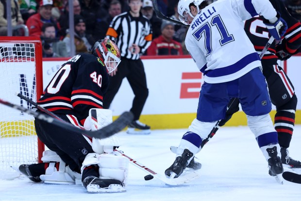Chicago Blackhawks goaltender Arvid Soderblom (40) defends the goal as Tampa Bay Lightning center Anthony Cirelli (71) tries to score in the second period of a game at the United Center in Chicago on Jan. 23, 2026. (Chris Sweda/Chicago Tribune)