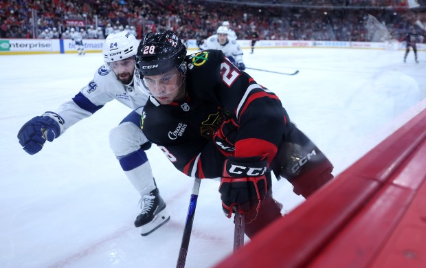 Chicago Blackhawks left wing Andre Burakovsky (28) skates along the boards in the third period of a game against the Tampa Bay Lightning at the United Center in Chicago on Jan. 23, 2026. (Chris Sweda/Chicago Tribune)