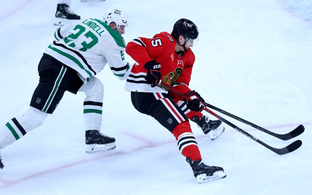 Chicago Blackhawks right wing Ilya Mikheyev (95) puts a move on Dallas Stars defenseman Esa Lindell (23) before Mikheyev scored a goal in the second period of a game at the United Center in Chicago on Jan. 1, 2026. (Chris Sweda/Chicago Tribune)