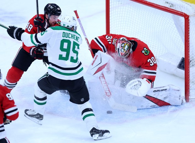 Chicago Blackhawks goaltender Spencer Knight (30) males a save in the third period of a game against the Dallas Stars at the United Center in Chicago on Jan. 1, 2026. (Chris Sweda/Chicago Tribune)
