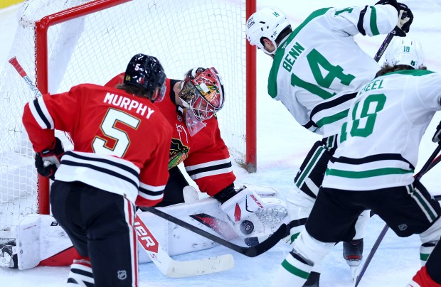 Chicago Blackhawks goaltender Spencer Knight (30) makes a save in the second period of a game against the Dallas Stars at the United Center in Chicago on Jan. 1, 2026. (Chris Sweda/Chicago Tribune)