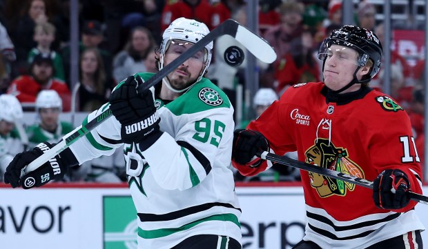Dallas Stars center Matt Duchene (95) and Chicago Blackhawks center Oliver Moore (11) battle for the puck in the first period of a game at the United Center in Chicago on Jan. 1, 2026. (Chris Sweda/Chicago Tribune)