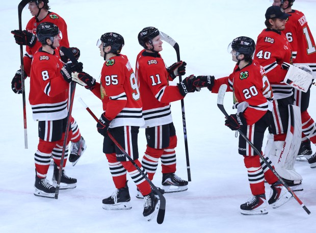 Chicago Blackhawks players Ryan Donato (8), Ilya Mikheyev (95), Oliver Moore (11), and Ryan Greene (20), celebrate after their victory over the Dallas Stars at the United Center in Chicago on Jan. 1, 2026. (Chris Sweda/Chicago Tribune)