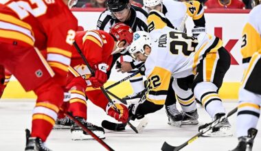 CALGARY, AB - OCTOBER 25: Calgary Flames Center Mikael Backlund (11) and Pittsburgh Penguins Winger Sam Poulin (22) take a face-off during the third period of an NHL game between the Calgary Flames and the Pittsburgh Penguins on October 25, 2022, at the Scotiabank Saddledome in Calgary, AB. (Photo by Brett Holmes/Icon Sportswire via NHL/Getty Images)