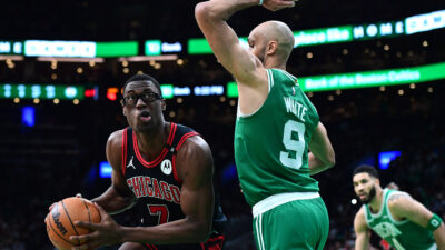 Jan 29, 2025; Boston, Massachusetts, USA; Chicago Bulls forward Jalen Smith (7) controls the ball while Boston Celtics guard Derrick White (9) defends during the second half at TD Garden.