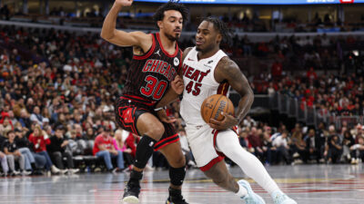 Nov 21, 2025; Chicago, Illinois, USA; Miami Heat guard Davion Mitchell (45) drives to the basket against Chicago Bulls guard Tre Jones (30) during the second half at United Center.