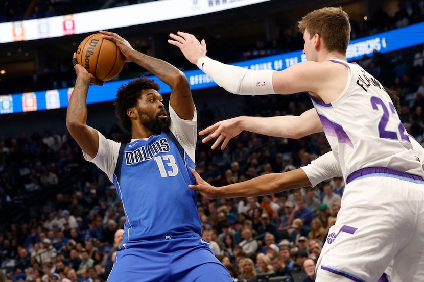 Dallas Mavericks forward Naji Marshall (13) keeps the ball away from Utah Jazz forward Kyle...