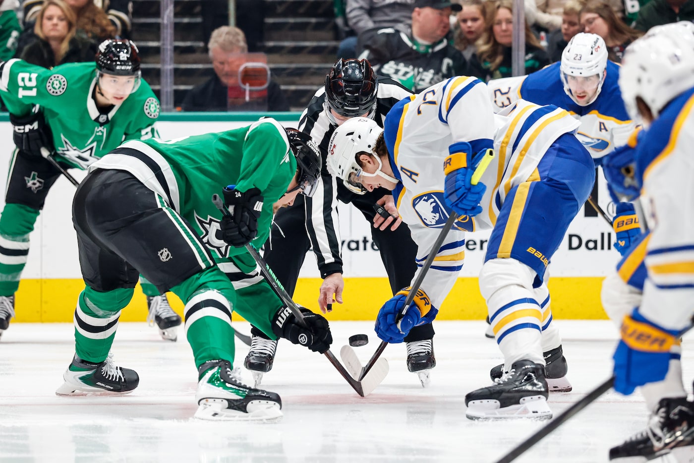 Dallas Stars’ Miro Heiskanen (4) and Buffalo Sabres’ Tage Thompson (72) face off during a...