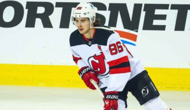 New Jersey Devils center Jack Hughes (86) talks with his brother defenseman Luke Hughes (43) before the start of the third period against the Pittsburgh Penguins at PPG Paints Arena.