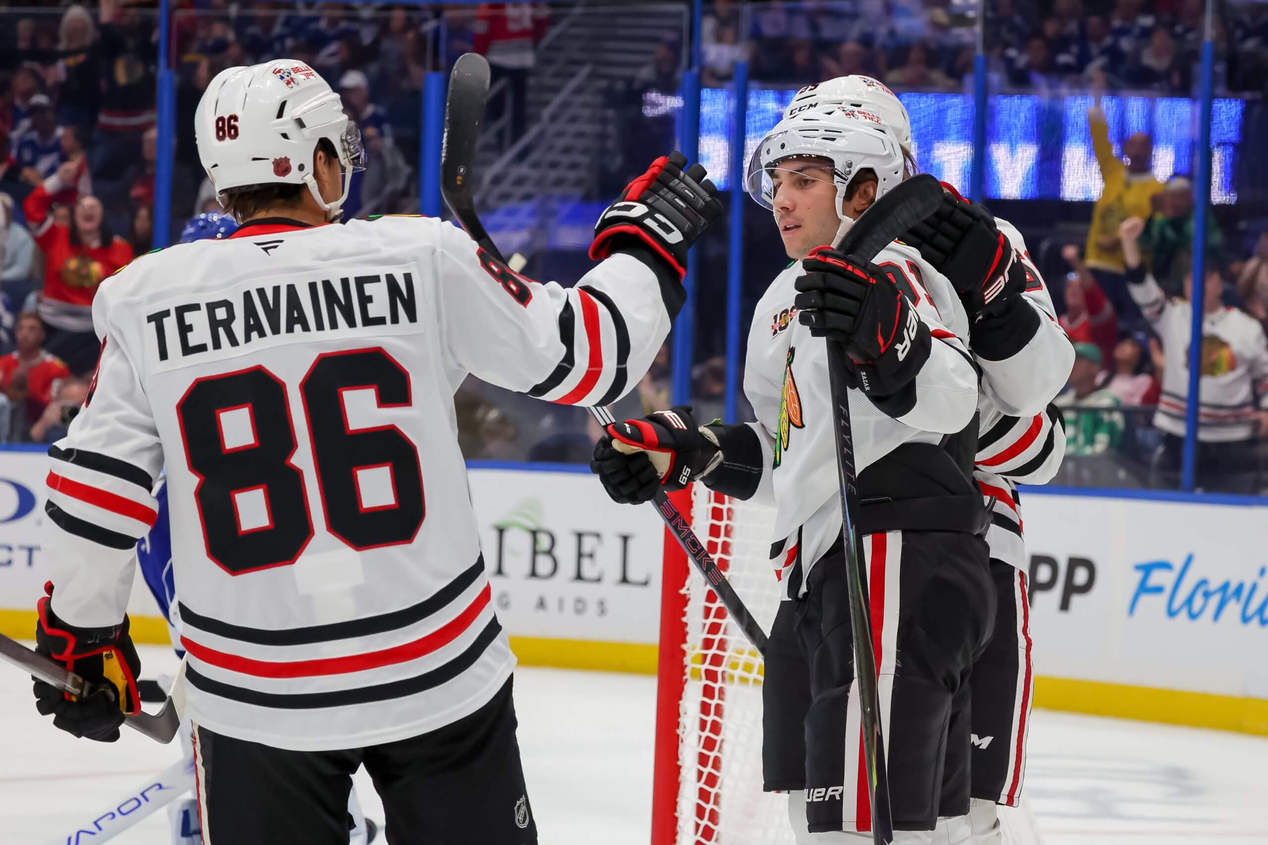 Teuvo Teravainen and Frank Nazar celebrate a Blackhawks goal.