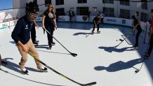 MIAMI, FLORIDA - JANUARY 9: Students put on hockey gear and try out their rink during the Legacy Project for the 2026 Discover Winter Classic is a partnership between the NHL, the Florida Panthers, and the SLAM! School Miami. This is to establish a permanent home for the synthetic auxiliary rink used during the Winter Classic game at SLAM! Miami School Gym Space on January 9, 2026 in Miami, Florida. (Photo by Eliot J. Schechter/NHLI via Getty Images)