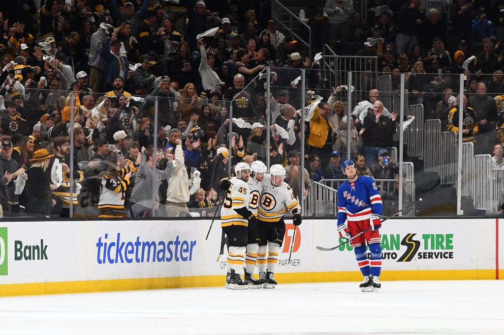 Jonathan Aspirot #45, Pavel Zacha #18 and Casey Mittelstadt #11 of the Boston Bruins celebrate the first-period goal against the New York Rangers at the TD Garden on January 10, 2026 in Boston, Massachusetts.