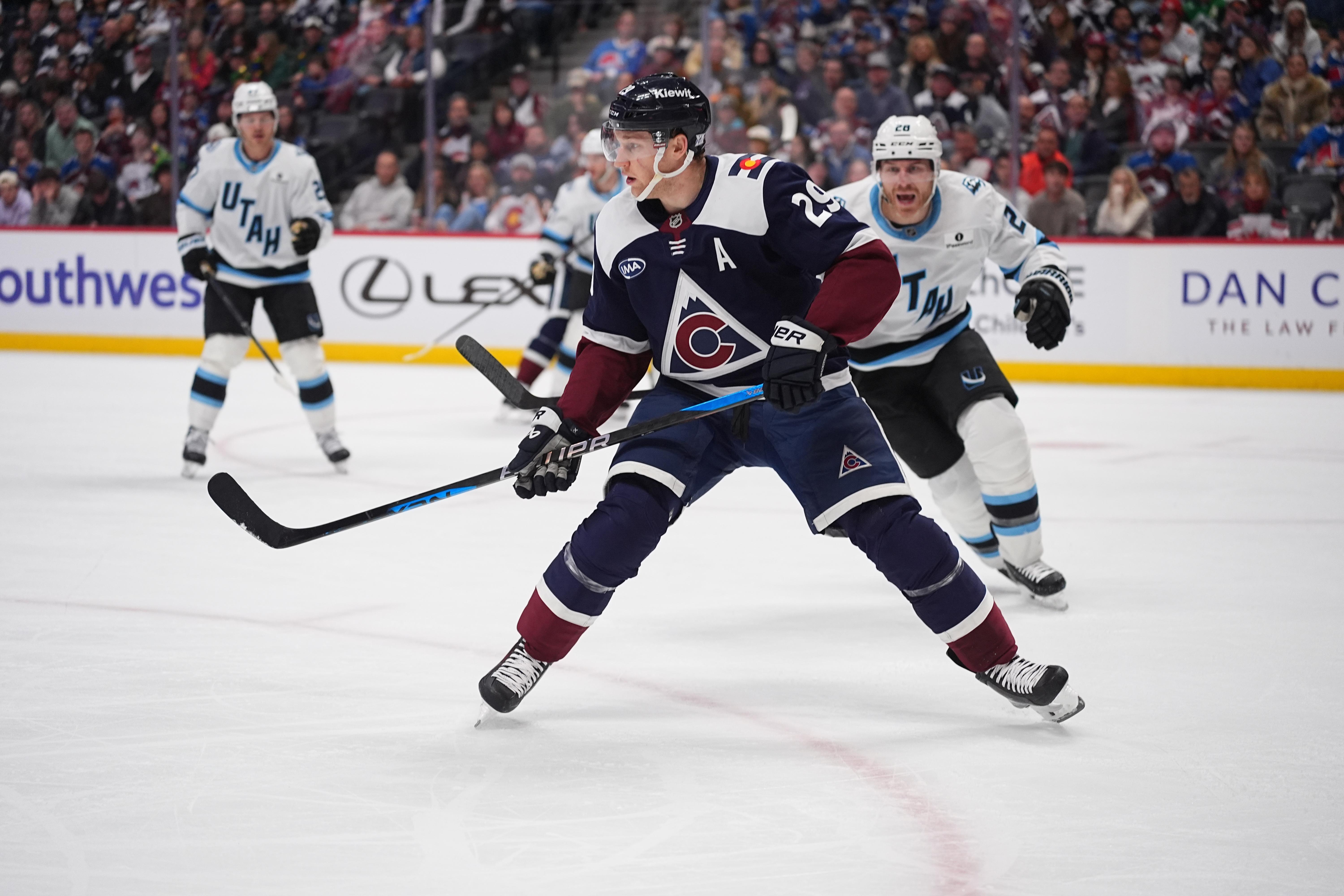 FILE – Colorado Avalanche center Nathan MacKinnon (29) and Utah...