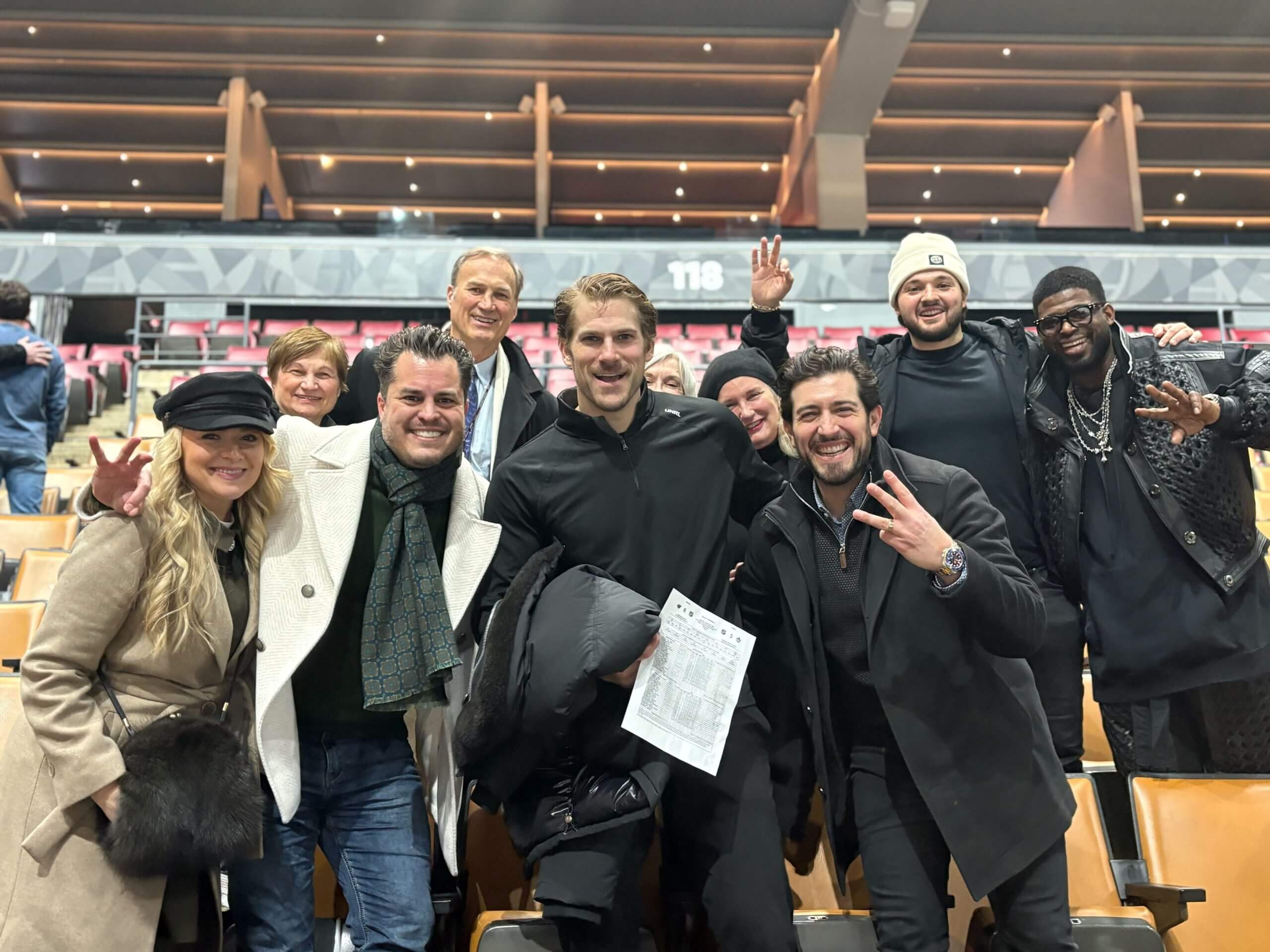 Marcus Foligno poses in the center of the picture with friends and family.