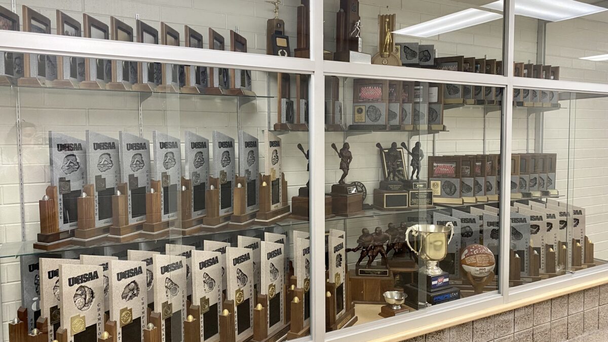 (One of) Park City High School's sports trophy cases displaying the three state championships awards from when Colten McIntyre joined his Ice Miners hockey team.