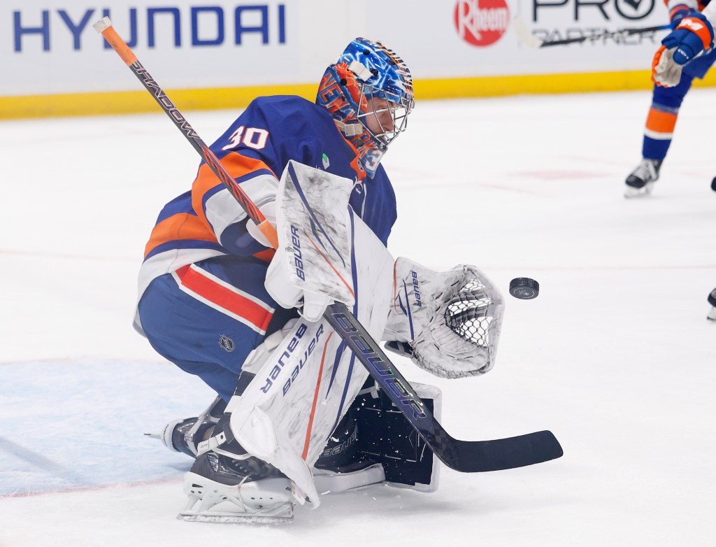 Ilya Sorokin makes a glove save during the Islanders' blowout win over the Devils.