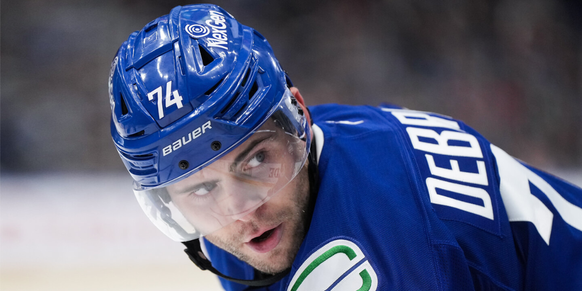 Jake DeBrusk #74 skating for the Vancouver Canucks