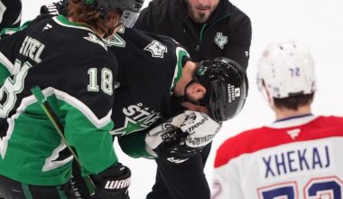 Dallas Stars left wing Jamie Benn, center, is helped off the ice as teammate center Sam Steel (18) and Montréal Canadiens defenseman Arber Xhekaj (72) look on during the third period of an NHL hockey game Sunday, Jan. 4, 2026, in Dallas. (AP Photo/LM Otero)