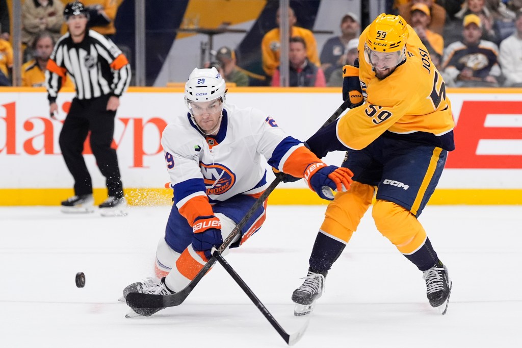 Jonathan Drouin looks to  block Roman Josi's shot during overtime of the Islanders' shootout loss to the Predators on Jan. 8, 2025.