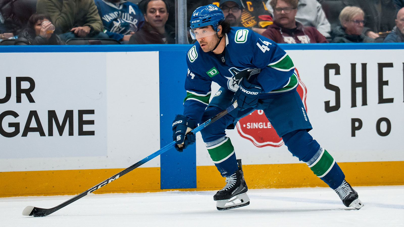 Vancouver Canucks forward Kiefer Sherwood (44) handles the puck against the Seattle Kraken in the second period at Rogers Arena.
