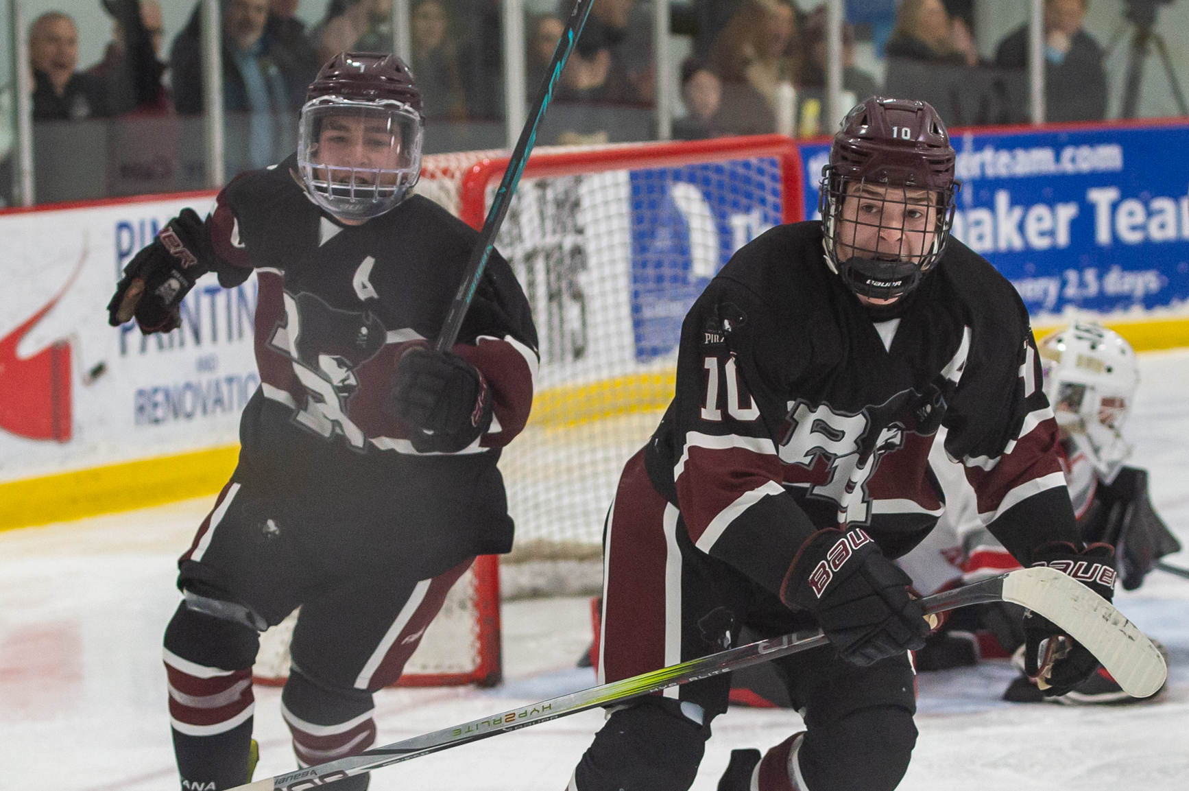 Rocky River's Noah Opdycke, right, celebrates his goal against Mentor...