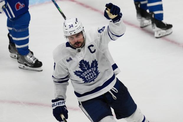 Toronto Maple Leafs center Auston Matthews celebrates after scoring a goal against the Colorado Avalanche in the third period of an NHL hockey game Monday, Jan. 12, 2026, in Denver. (AP Photo/David Zalubowski)