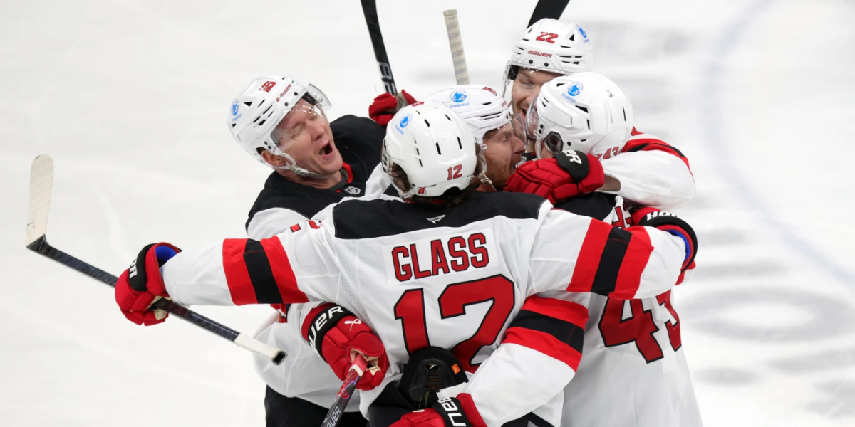 New Jersey Devils Cody Glass, Ondrej Palat, Brett Pesce, Connor Brown and Luke Hughes celebrate Hughes' third-period game-winning goal against the Columbus Blue Jackets.
