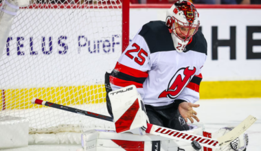 Jacob Markstrom makes a bare-handed save for the New Jersey Devils in the second period against the Calgary Flames on Monday night.
