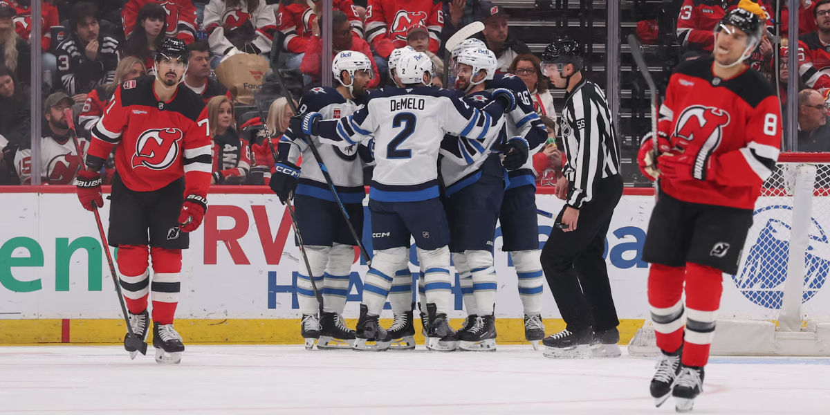 Jonas Siegenthaler (71 and Johnathan Kovacevic (8) react following a Winnipeg Jets goal against the New Jersey Devils on Tuesday night at the Prudential Center.