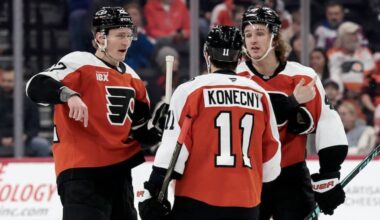 Flyers # 22 Christian Dvorak, # 11 Travis Konecny and # 46 Trevor Zegras gather during a stoppage in play during the New York Rangers vs. Philadelphia Flyers NHL game at Xfinity Mobile Arena in Philadelphia on Saturday, Jan. 17, 2026.