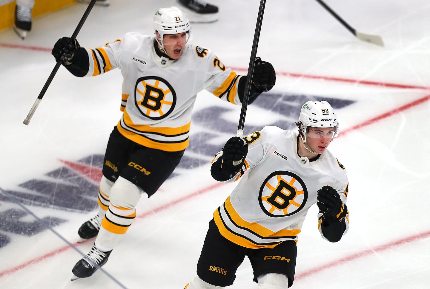 Young Bruins center Fraser Minten (right), celebrating with winger Alex Steeves one of his two goals against the Rangers on Jan. 10, has picked up his offense in the new year.