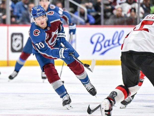 Sam Malinski (70) of the Colorado Avalanche passes during the first period against the New Jersey Devils at Ball Arena on Tuesday, Oct. 28, 2025. (Photo by AAron Ontiveroz/The Denver Post)